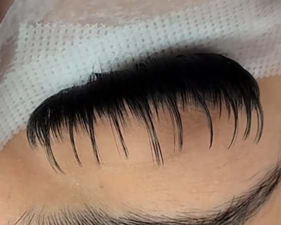 Wispy spikes on a fresh set, eyes taped