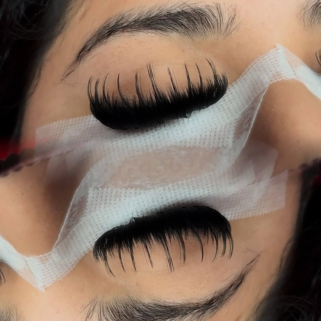 Wispy spikes on a fresh set, eyes taped